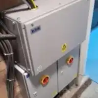 a machine that is sitting next to a pool