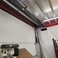 a view of a room with a metal ceiling