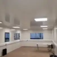 a large empty room with a lot of windows